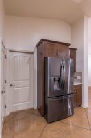 Cabinetry around Stainless steel fridge