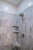 Shower fixtures and tile shelves