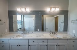 Double sink in Master Bath with double mirrors and lights