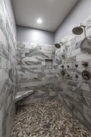 Pebble shower floor and brick style walls