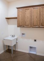 Laundry room with deep utility tub